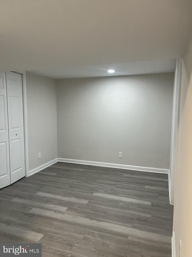 5511 Wesley Ave, Baltimore, MD 21207 - unfurnished bedroom featuring dark wood-type flooring and recessed lighting
