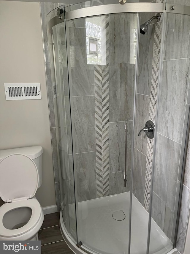 5511 Wesley Ave, Baltimore, MD 21207 - full bathroom featuring toilet and a stall shower