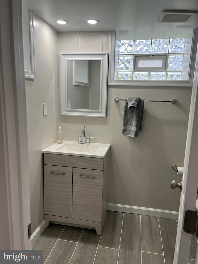 5511 Wesley Ave, Baltimore, MD 21207 - bathroom with vanity and wood tiled floors