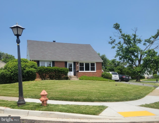 3700 Eastman Rd, Randallstown, MD 21133 - view of front facade with brick siding and a front yard