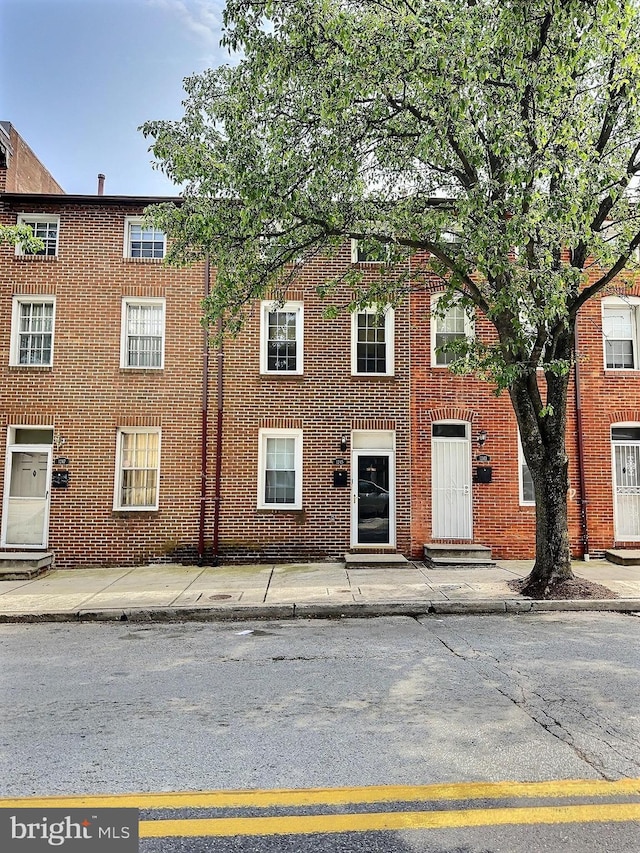 1245 E Eager St, Baltimore, MD 21202 - townhome / multi-family property with brick siding