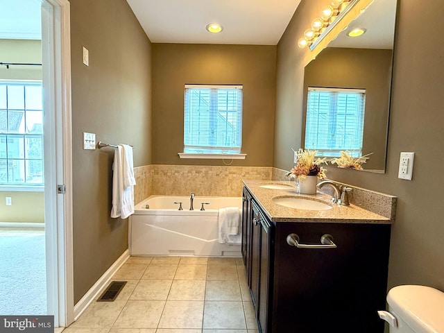 331 Lenape Way, Claymont, DE 19703 - bathroom featuring plenty of natural light, a garden tub, double vanity, and tile patterned floors