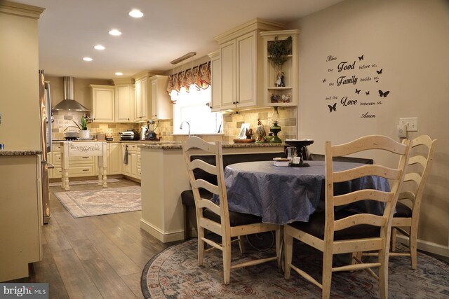 146 Skyline Dr, New Holland, PA 17557 - kitchen with wall chimney exhaust hood, recessed lighting, dark wood-style floors, tasteful backsplash, and light stone countertops