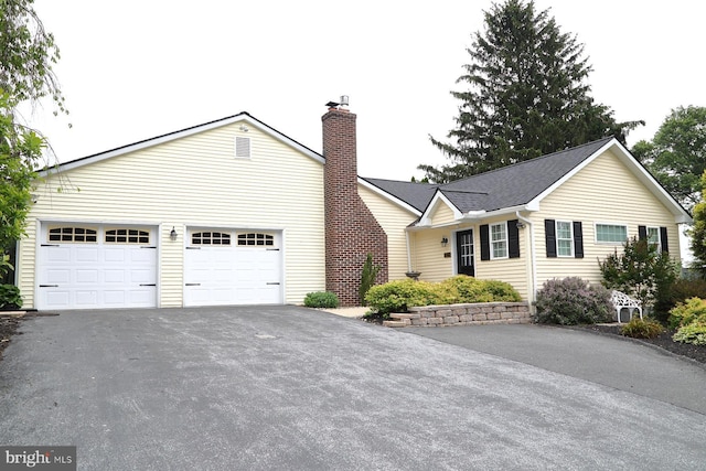 146 Skyline Dr, New Holland, PA 17557 - ranch-style home featuring driveway, a chimney, and a garage