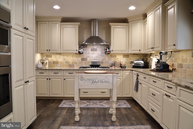 146 Skyline Dr, New Holland, PA 17557 - kitchen featuring wall chimney range hood, stainless steel gas stovetop, dark wood-style floors, wall oven, and backsplash