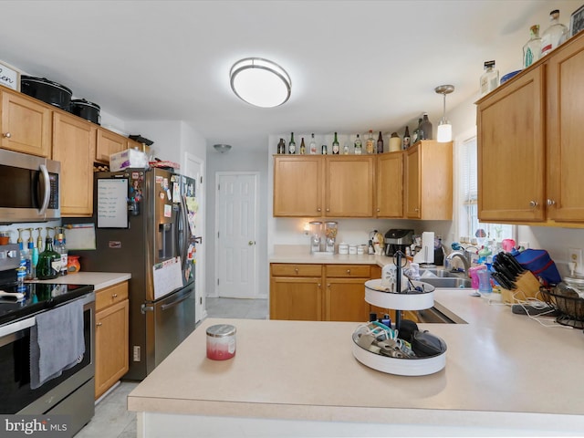 6 Thompson Ct, Boonsboro, MD 21713 - kitchen featuring stainless steel appliances, light countertops, a peninsula, and decorative light fixtures
