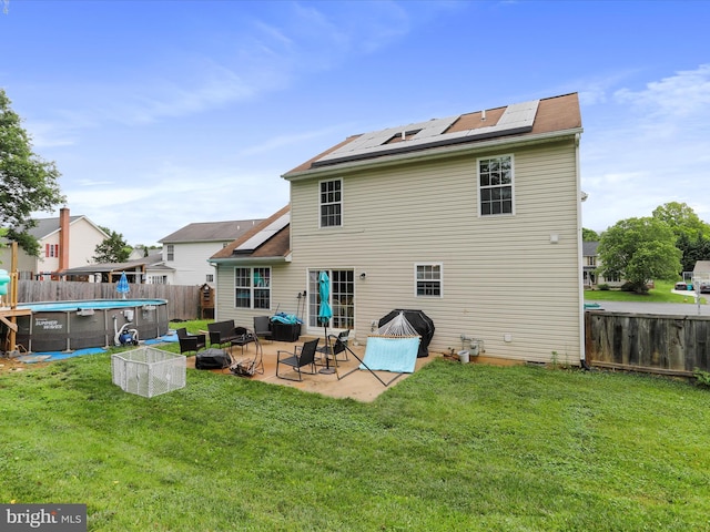 6 Thompson Ct, Boonsboro, MD 21713 - rear view of house featuring roof mounted solar panels, a fenced backyard, and a patio