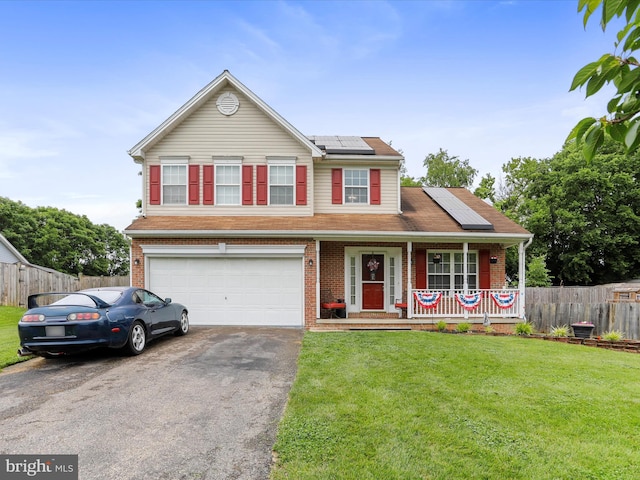 6 Thompson Ct, Boonsboro, MD 21713 - traditional-style house featuring asphalt driveway, a porch, an attached garage, roof mounted solar panels, and brick siding
