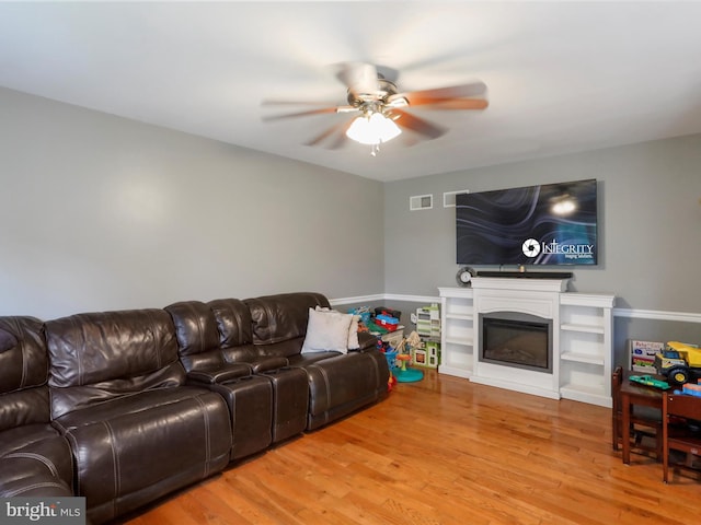 6 Thompson Ct, Boonsboro, MD 21713 - living room featuring a ceiling fan, wood finished floors, and a glass covered fireplace