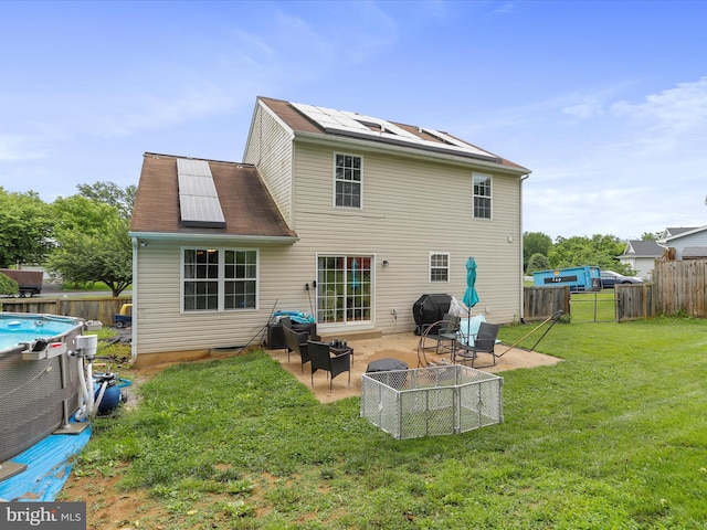 6 Thompson Ct, Boonsboro, MD 21713 - back of house with a fenced backyard, a patio area, and roof mounted solar panels