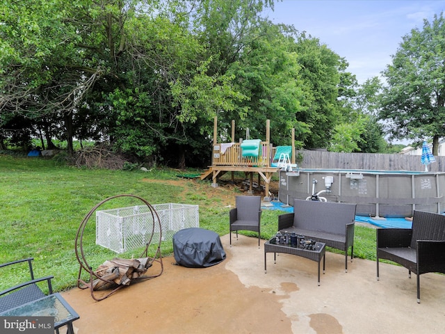 6 Thompson Ct, Boonsboro, MD 21713 - view of patio featuring a playground and view of wooded area