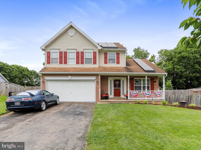 6 Thompson Ct, Boonsboro, MD 21713 - traditional-style house featuring asphalt driveway, a porch, an attached garage, roof mounted solar panels, and brick siding