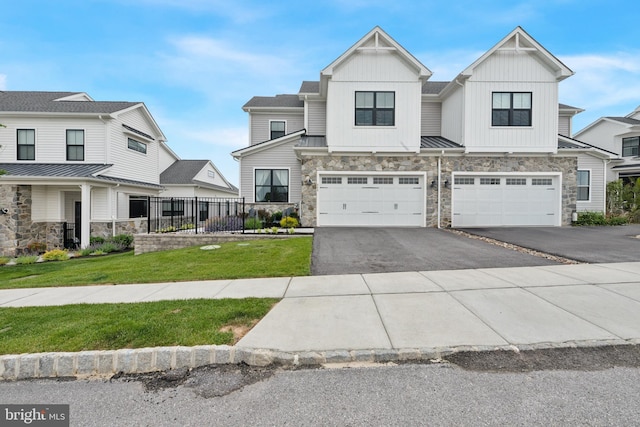 688 Appaloosa Rd, Downingtown, PA 19335 - view of property with stone siding, asphalt driveway, a garage, and board and batten siding
