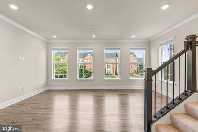 7955 Blue Stream Dr, Elkridge, MD 21075 - unfurnished living room featuring wood finished floors, crown molding, stairway, and recessed lighting