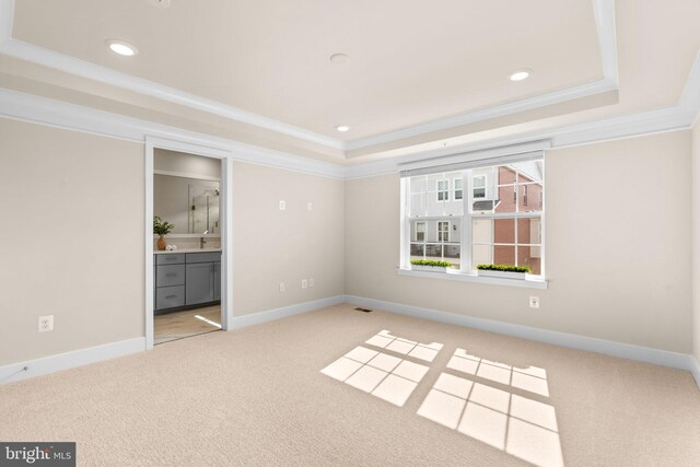 7955 Blue Stream Dr, Elkridge, MD 21075 - unfurnished bedroom with a tray ceiling, carpet floors, recessed lighting, ornamental molding, and connected bathroom