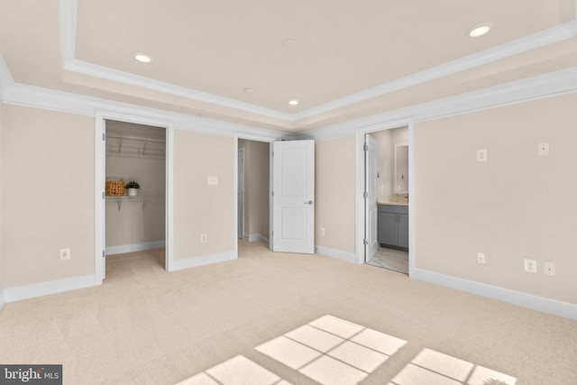 7955 Blue Stream Dr, Elkridge, MD 21075 - unfurnished bedroom with a tray ceiling, ornamental molding, light carpet, recessed lighting, and a spacious closet