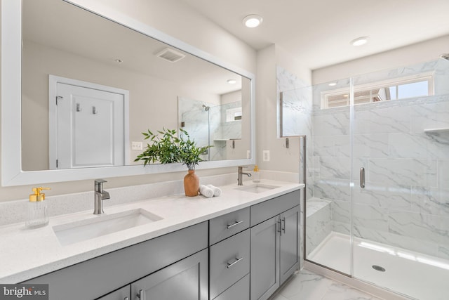 7955 Blue Stream Dr, Elkridge, MD 21075 - bathroom with double vanity, a marble finish shower, marble look tiles, and recessed lighting