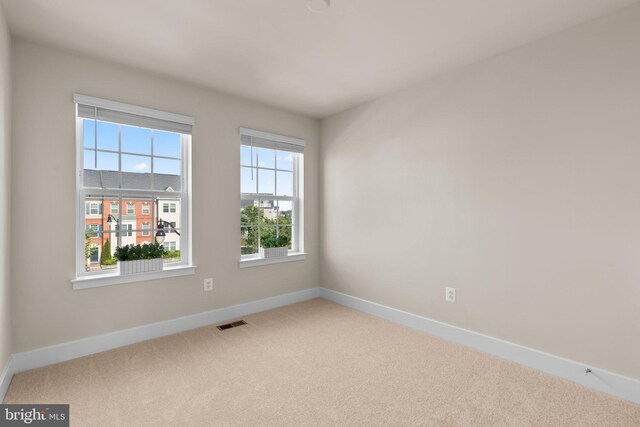 7955 Blue Stream Dr, Elkridge, MD 21075 - carpeted empty room with baseboards