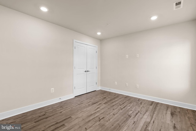 7955 Blue Stream Dr, Elkridge, MD 21075 - unfurnished bedroom with wood finished floors, recessed lighting, and a closet