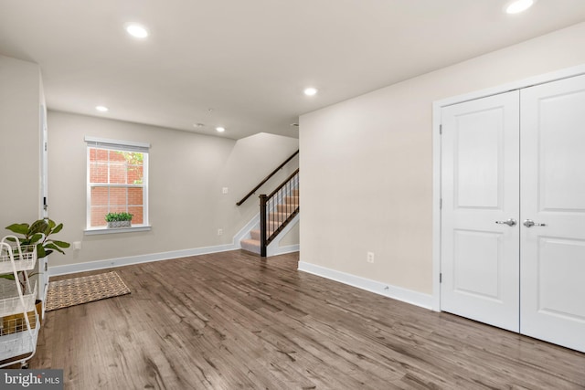 7955 Blue Stream Dr, Elkridge, MD 21075 - unfurnished living room with wood finished floors, stairs, and recessed lighting