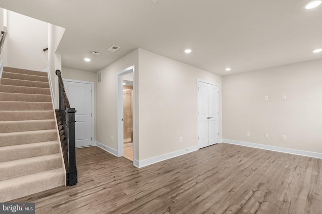 7955 Blue Stream Dr, Elkridge, MD 21075 - unfurnished room featuring wood finished floors, stairs, and recessed lighting