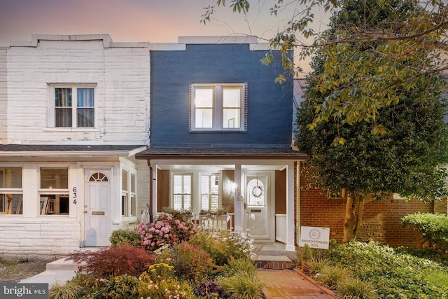 636 N Alfred St, Alexandria, VA 22314 - view of front of house featuring covered porch and stone siding