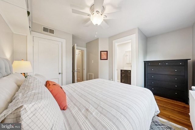 636 N Alfred St, Alexandria, VA 22314 - bedroom with wood finished floors, ensuite bathroom, and ceiling fan
