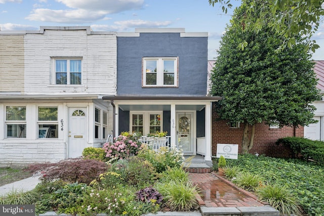 636 N Alfred St, Alexandria, VA 22314 - view of front of property with covered porch and stone siding