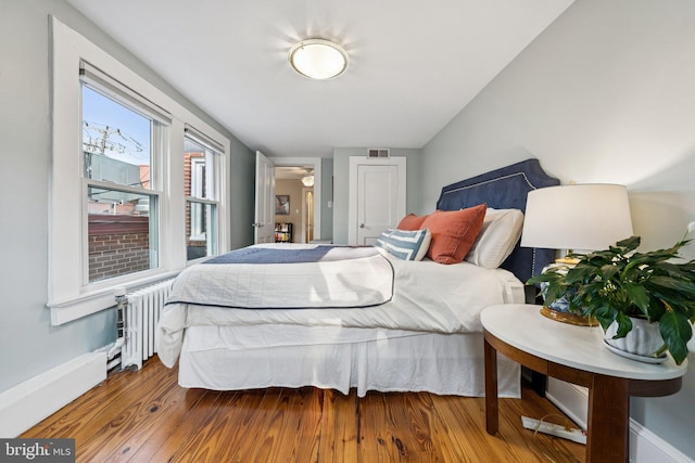 636 N Alfred St, Alexandria, VA 22314 - bedroom with radiator and wood finished floors