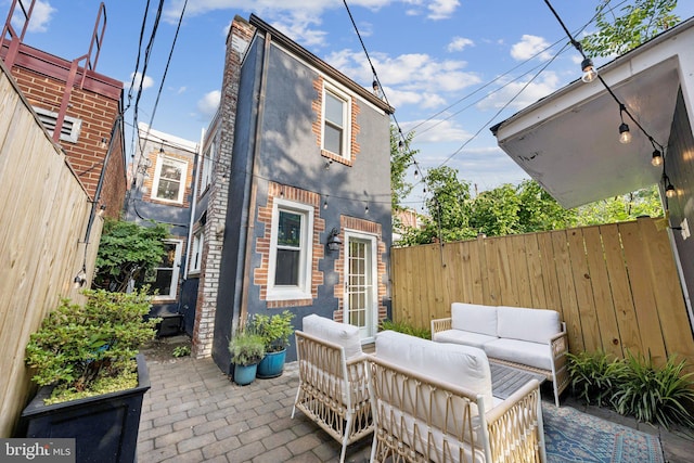 636 N Alfred St, Alexandria, VA 22314 - fenced backyard with a patio area and outdoor lounge area