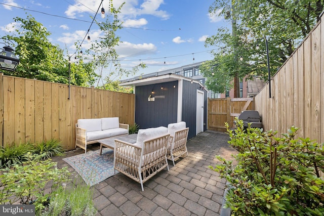 636 N Alfred St, Alexandria, VA 22314 - fenced backyard with a patio area, a shed, and an outdoor hangout area