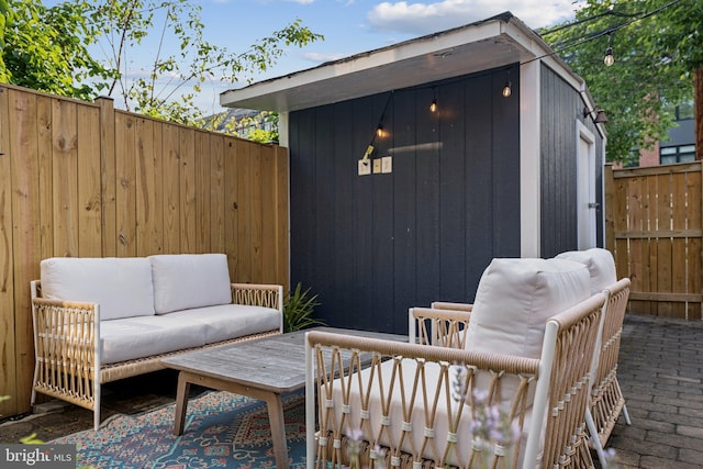 636 N Alfred St, Alexandria, VA 22314 - view of patio with an outdoor hangout area and a shed