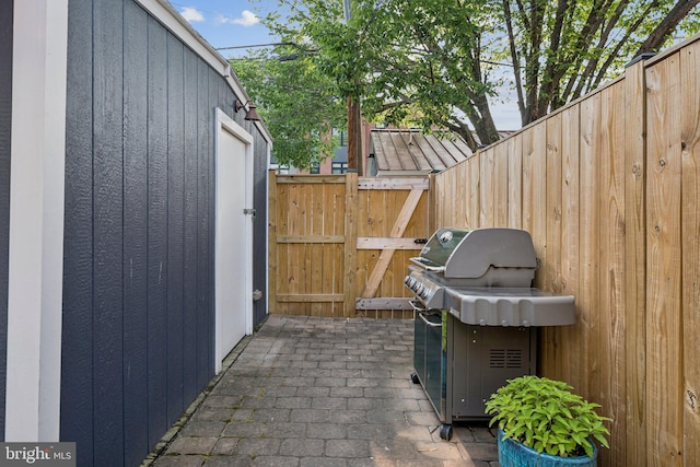 636 N Alfred St, Alexandria, VA 22314 - view of patio featuring area for grilling and a gate