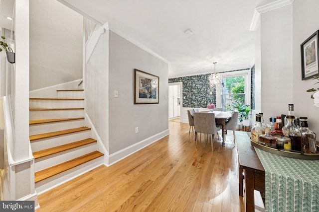 636 N Alfred St, Alexandria, VA 22314 - dining space featuring light wood-type flooring, stairway, ornamental molding, and a chandelier