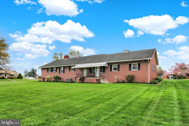 401 Jacobs St, East Berlin, PA 17316 - back of house with brick siding, a chimney, and a yard
