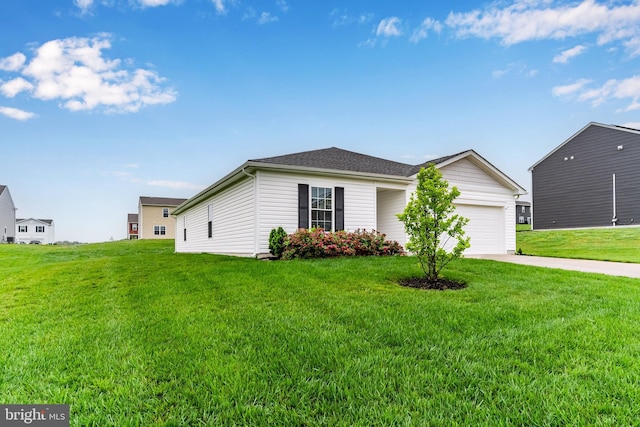 9 American Ave, Carlisle, PA 17013 - view of front of home featuring an attached garage, concrete driveway, and a front yard