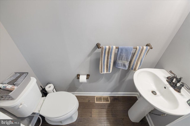 260 Grace Ln, Harleysville, PA 19438 - half bathroom with baseboards and wood finished floors