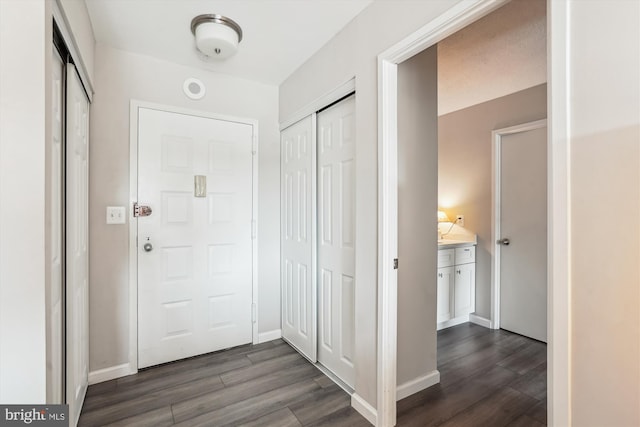 8370 Greensboro Dr Unit 1011, Mclean, VA 22102 - entrance foyer with dark wood-style flooring and baseboards