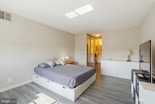 8370 Greensboro Dr Unit 1011, Mclean, VA 22102 - bedroom featuring wood finished floors and baseboards