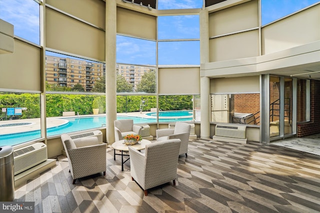 8370 Greensboro Dr Unit 1011, Mclean, VA 22102 - view of patio with a wall unit AC, a community pool, and a hot tub