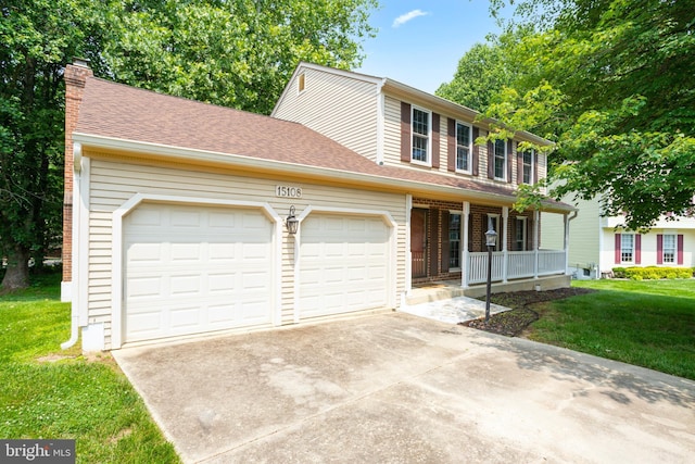 15108 Plum Tree Way, Bowie, MD 20721 - view of front of home featuring covered porch, an attached garage, concrete driveway, and a front yard