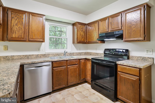 15108 Plum Tree Way, Bowie, MD 20721 - kitchen with stainless steel dishwasher, black range with electric cooktop, under cabinet range hood, light countertops, and brown cabinetry
