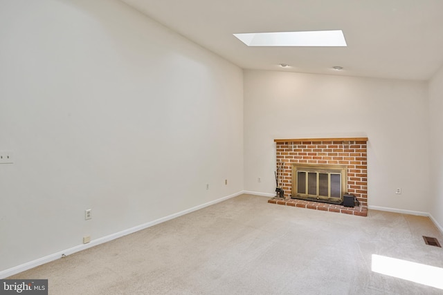 15108 Plum Tree Way, Bowie, MD 20721 - unfurnished living room featuring carpet, a skylight, a brick fireplace, and high vaulted ceiling