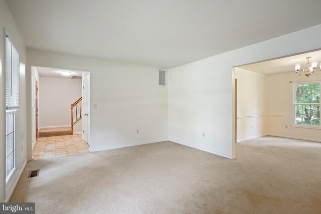 15108 Plum Tree Way, Bowie, MD 20721 - unfurnished room with carpet, stairs, and a chandelier