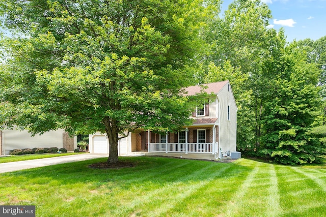 15108 Plum Tree Way, Bowie, MD 20721 - obstructed view of property featuring concrete driveway, covered porch, a front yard, and a garage