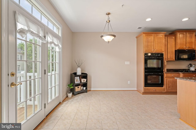 15196 Lancashire Dr, Woodbridge, VA 22191 - kitchen featuring black appliances, dark stone counters, pendant lighting, light tile patterned floors, and recessed lighting