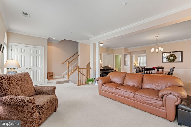 15196 Lancashire Dr, Woodbridge, VA 22191 - living room with carpet flooring, stairway, crown molding, a chandelier, and ornate columns