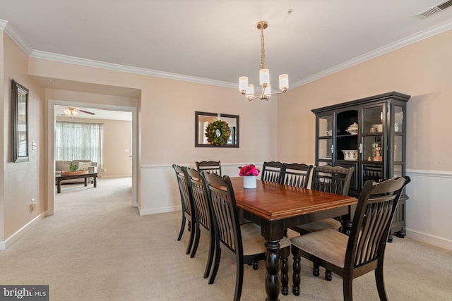 15196 Lancashire Dr, Woodbridge, VA 22191 - dining space with crown molding, a chandelier, and light colored carpet