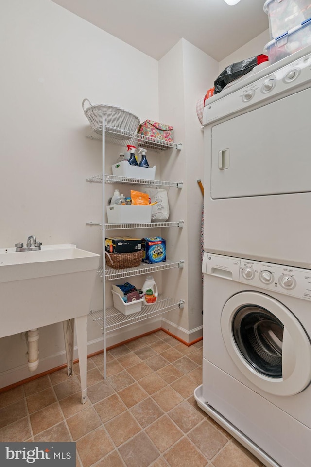 15196 Lancashire Dr, Woodbridge, VA 22191 - laundry room with stacked washer / dryer and baseboards