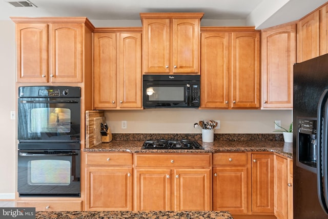 15196 Lancashire Dr, Woodbridge, VA 22191 - kitchen featuring black appliances and dark stone counters